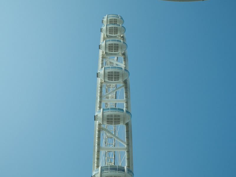 A tall observation tower against a clear blue sky.